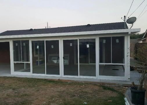 Panoramic sliding glass door installation by NG Windows and Doors